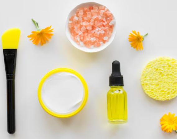 Flat lay of a skincare set with serum, moisturizer, and sunscreen