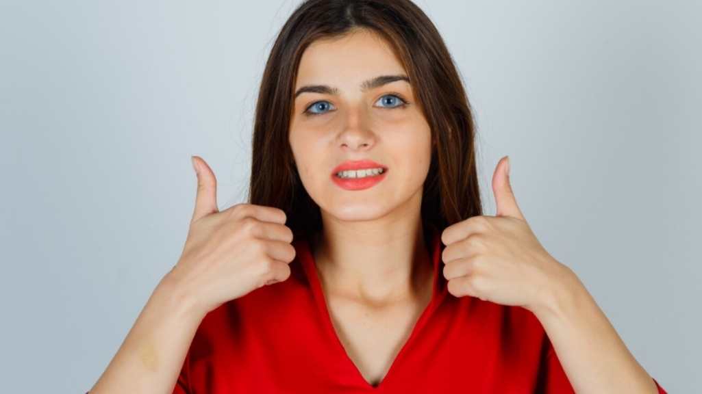 Happy customer giving thumbs up after using the best beauty product in Rajshahi